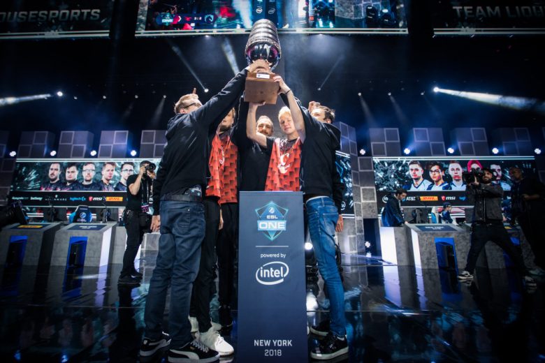 The Players standing on stage with holds a Winning Cup