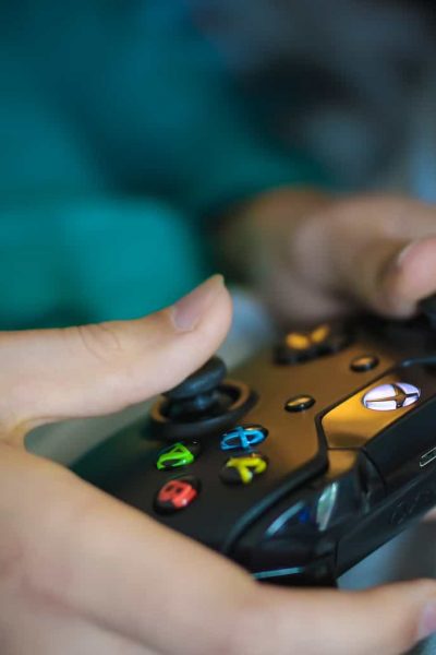 A hand holding a remote control